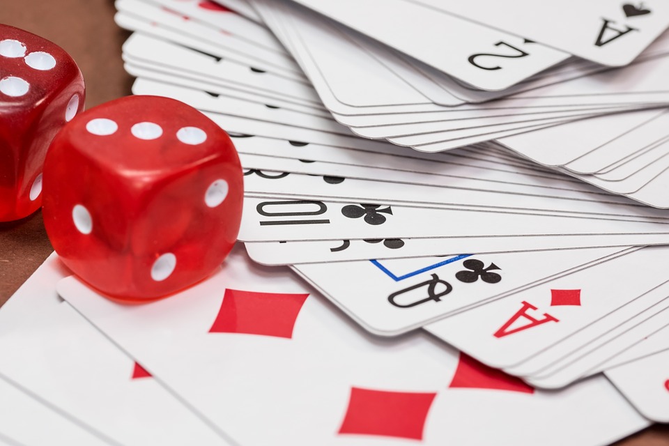Gin Card Game with Deck of Cards and Red Dices