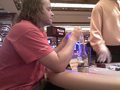 Photo of Long Haired Man Who is Winning at a Pai Gow Poker Game at the Golden Nugget