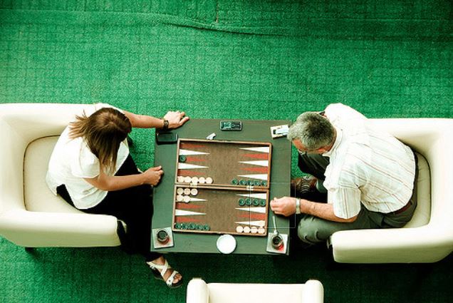 two people playing backgammon game