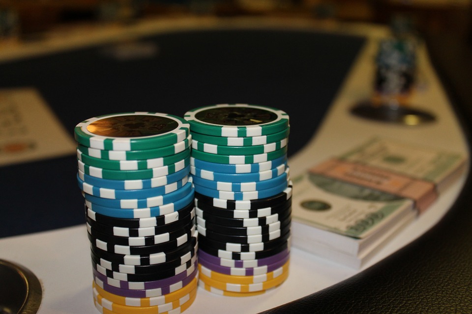 Poker chips near a bank notes